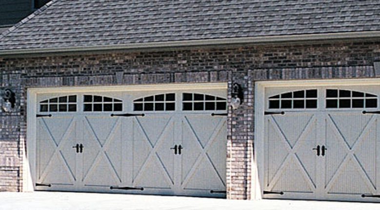 A garage door that is open and has two doors.